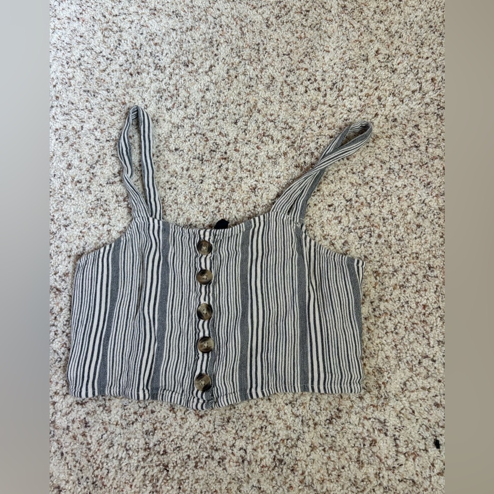 American Eagle stripped tank top. cream background with muted navy stripes